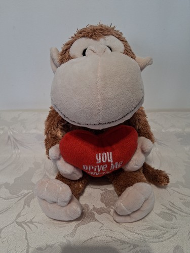 Tesco monkey soft toy holding - toy,